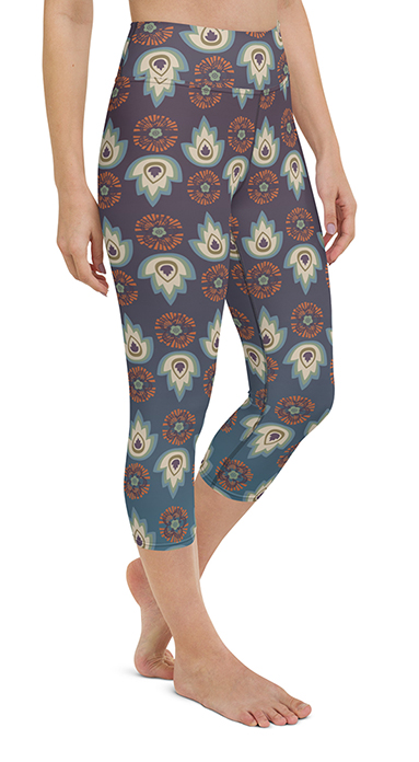 Capri yoga leggings with Asian inspired design motifs in purple, blue, and orange.